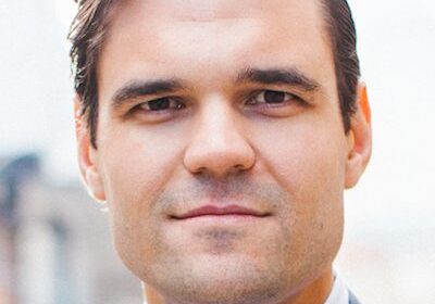 Portrait of a confident man in a suit outdoors.