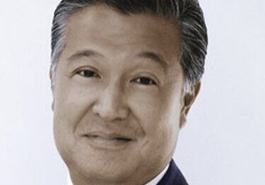 Portrait of a middle-aged man in a suit.